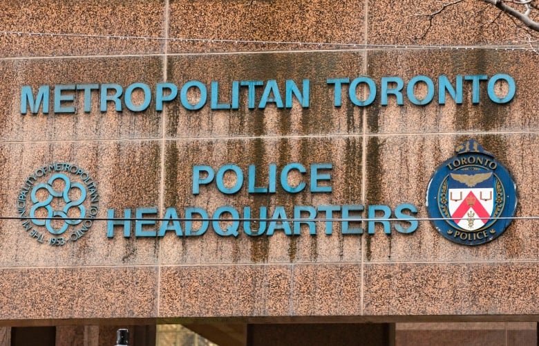 A sign reading Metropolitan Toronto Police Headquarters on a building downtown.