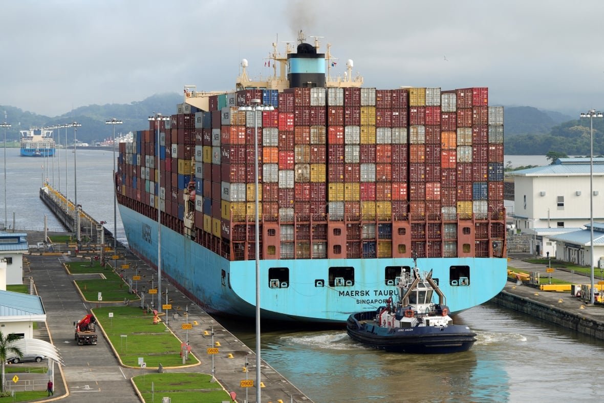 A container ship transit through a canal.