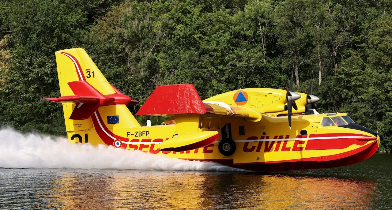 default-368 A Canadair aircraft collecting water from the River Seine in Ivry-sur-Seine to assist in firefighting efforts in the Fontainebleau forest near Paris on July 14.