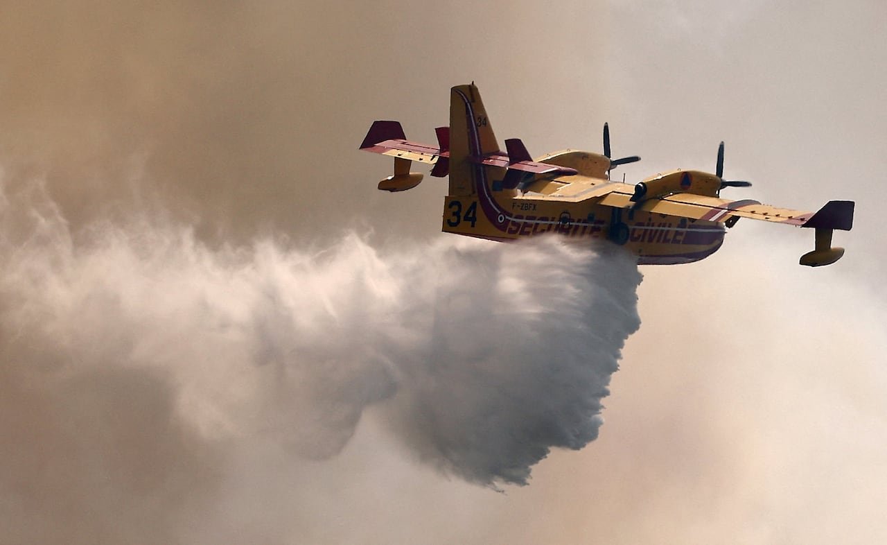 default-369 A Canadair aircraft dropping water on a wildfire in the Fox-Amphoux communal forest near Ponteves, France, on July 21.
