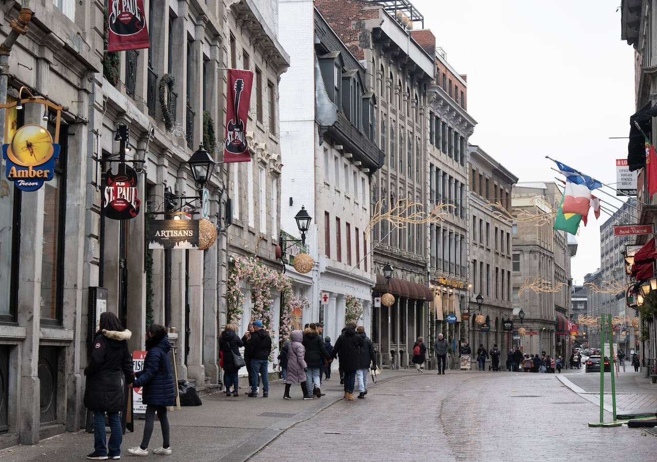 default-115 People walk on cobblestone streets in winter